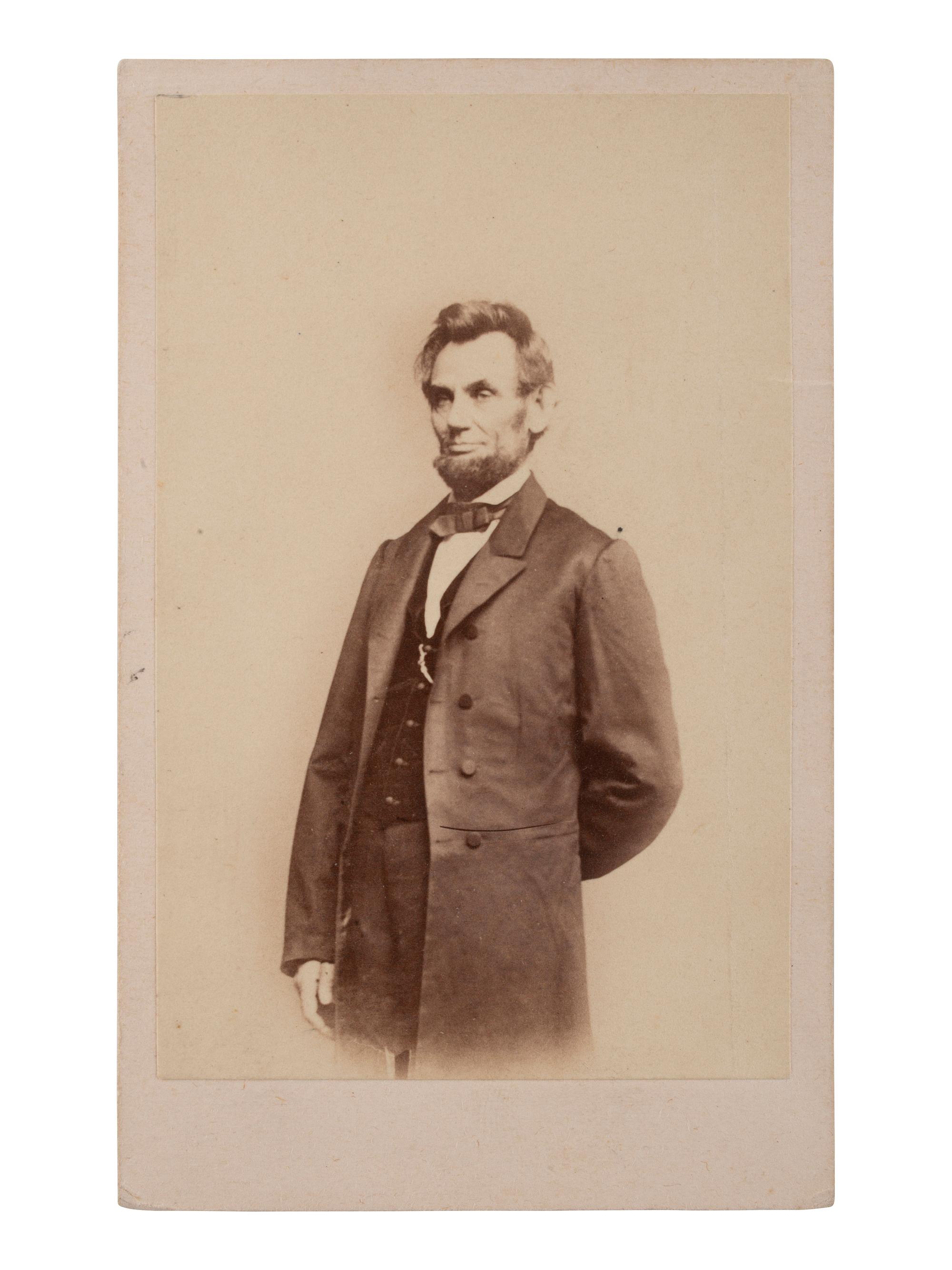 [LINCOLN, Abraham (1809-1865)]. A group of 12 CDVs of political figures, highlighted by a standing portrait of Abraham Lincoln.