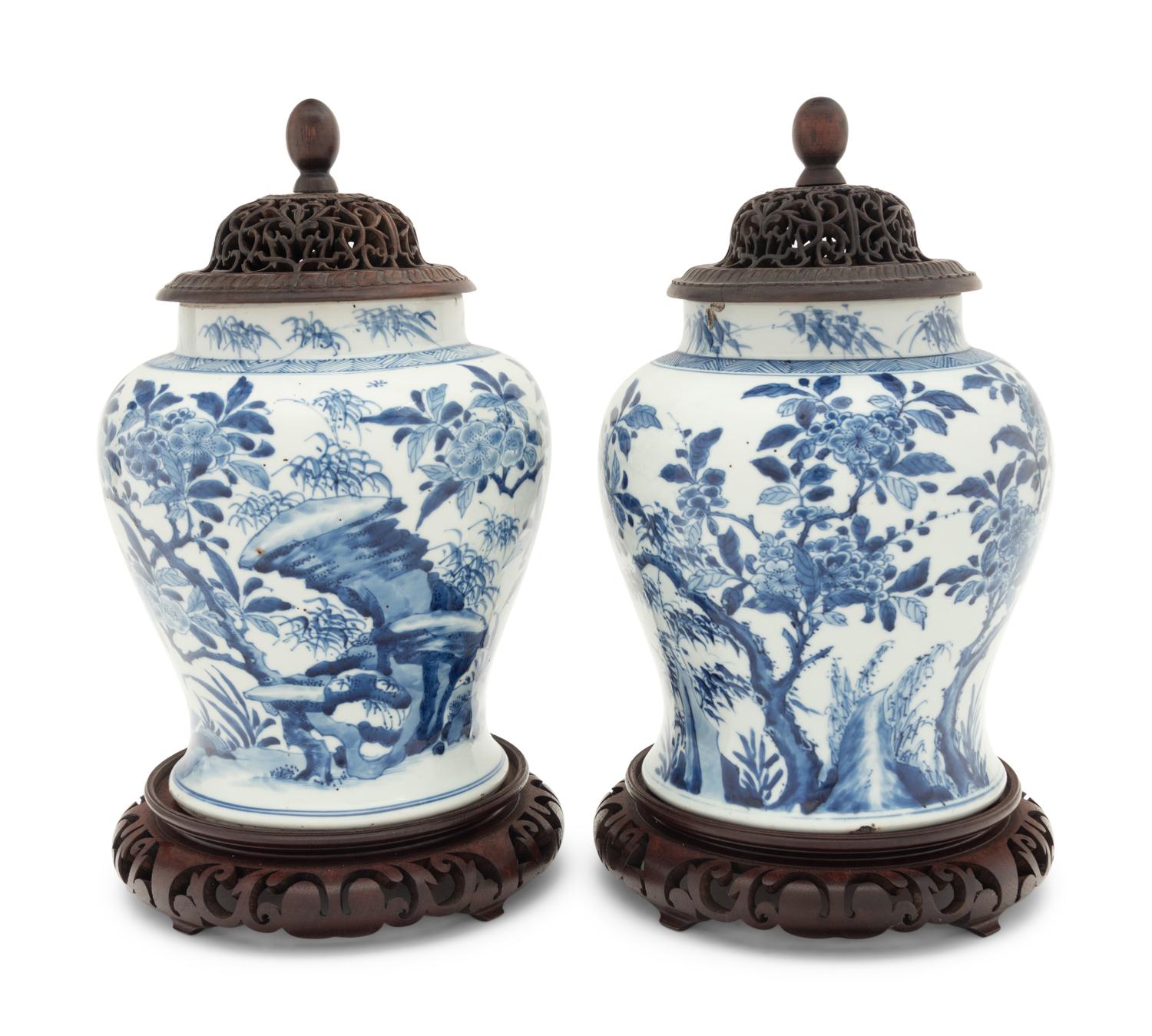 A Pair of Chinese Blue and White Porcelain Ginger Jars with Pierced Wood Lids and Stands