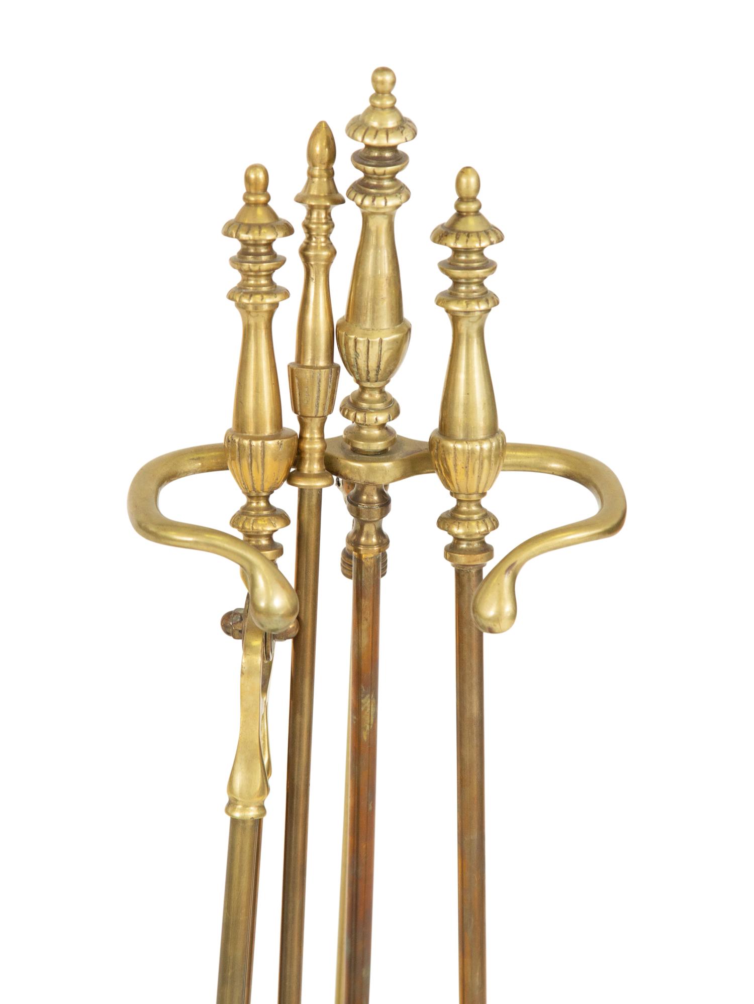Two Sets of Brass Fire Tools and a Pair of Brass Andirons