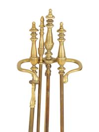 Two Sets of Brass Fire Tools and a Pair of Brass Andirons