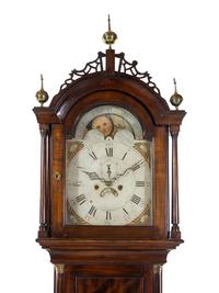A Federal Carved and Figured Mahogany Tall Case Clock