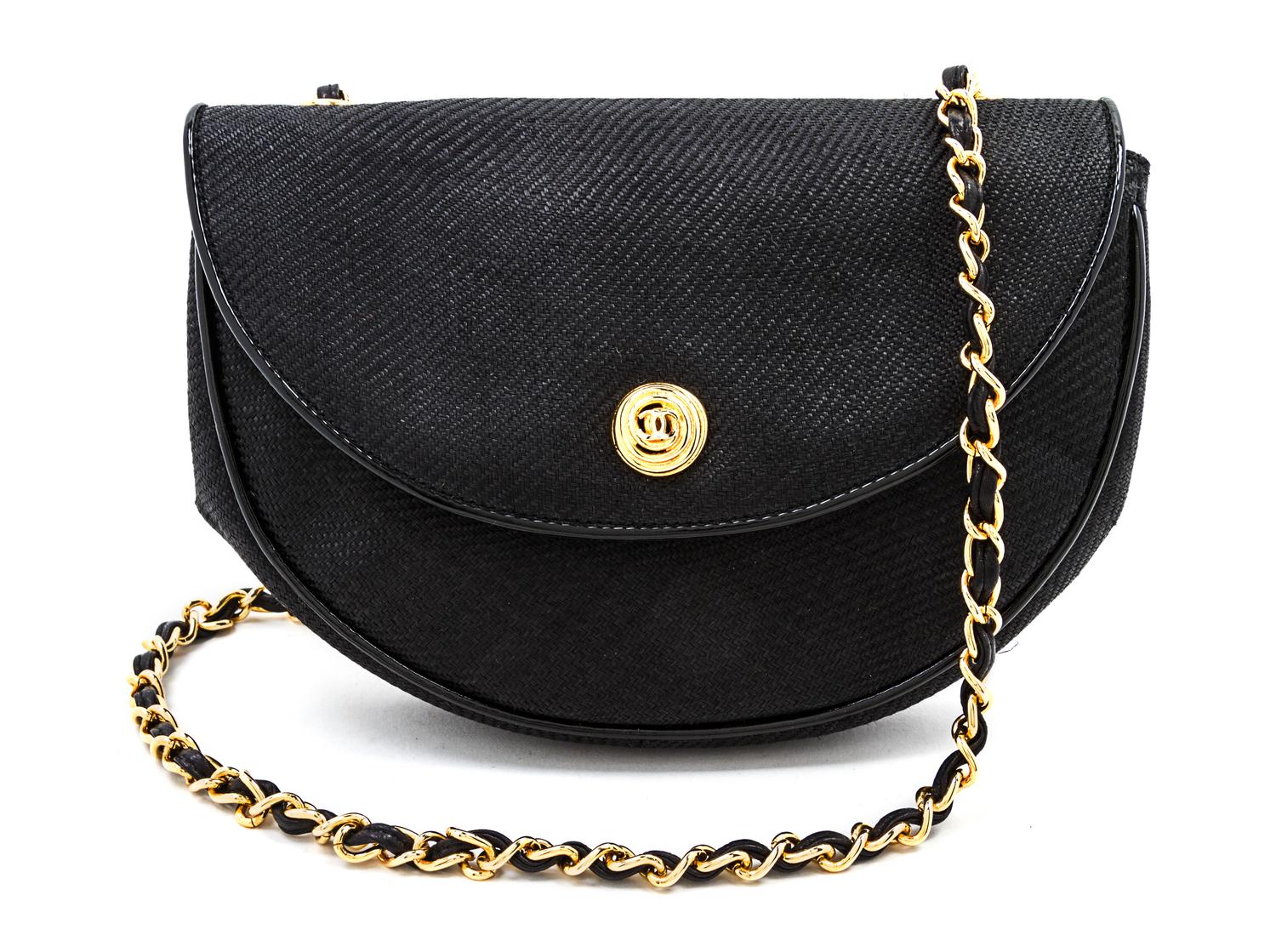 A Chanel Black Woven Straw Flap Bag, 8 x 6 x 2 inches.