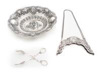 Three German Silver Articles, Late 19th century, comprising a fruit bowl, a purse frame with attached chain and serving tongs, each hav