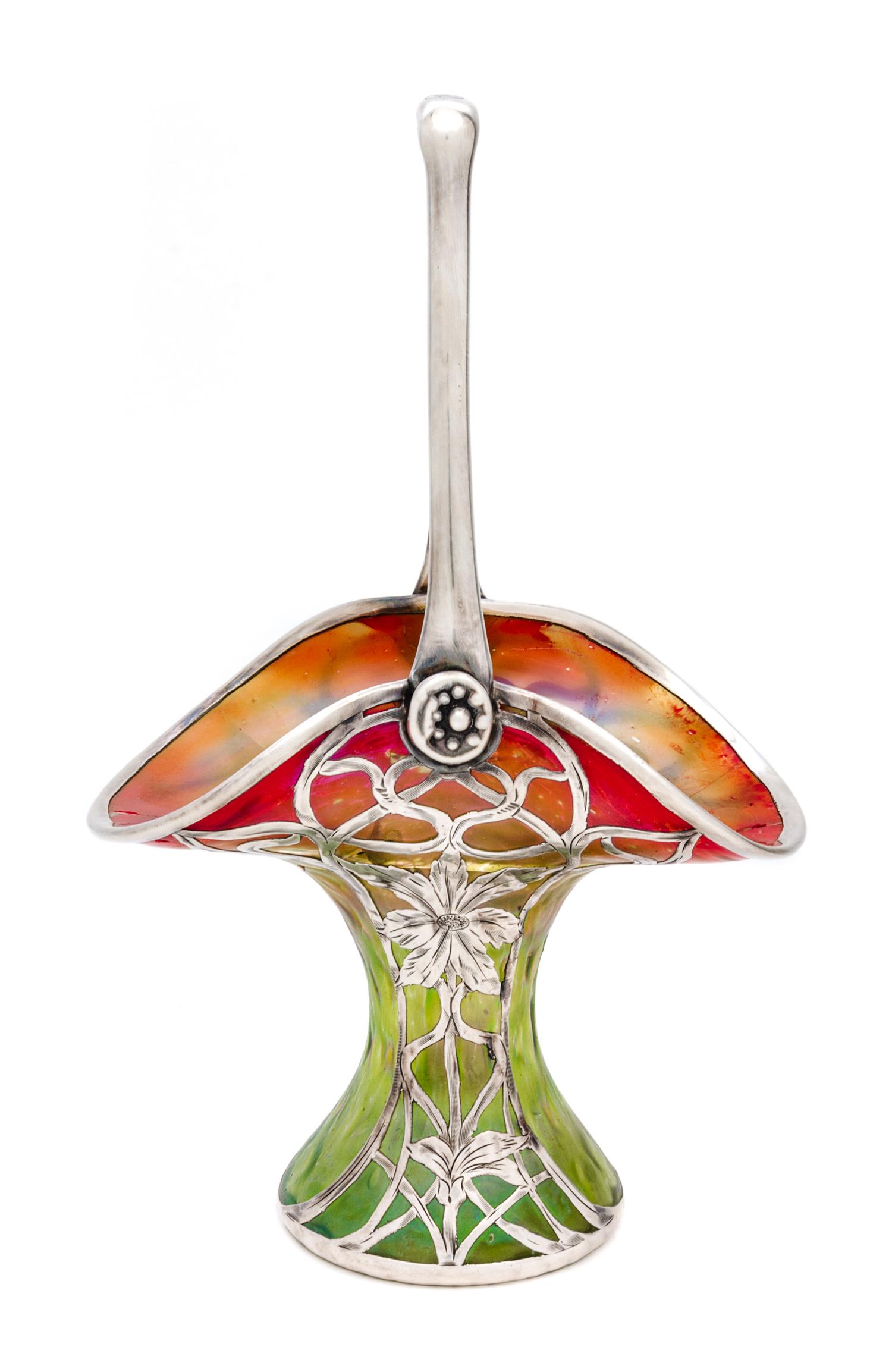 An Iridescent Glass Silver Overlay Basket, manner of Loetz Height 10 inches.
