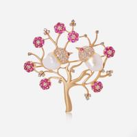 An 18K Yellow Gold, Pearl, and Ruby Brooch