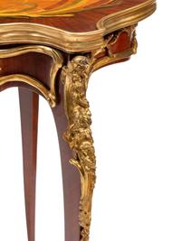 A Louis XV Style Gilt Bronze Mounted Marquetry Table