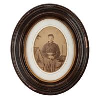 [CIVIL WAR]. Albumen photograph of Union artilleryman with sword. N.p.: n.p., [1860s].