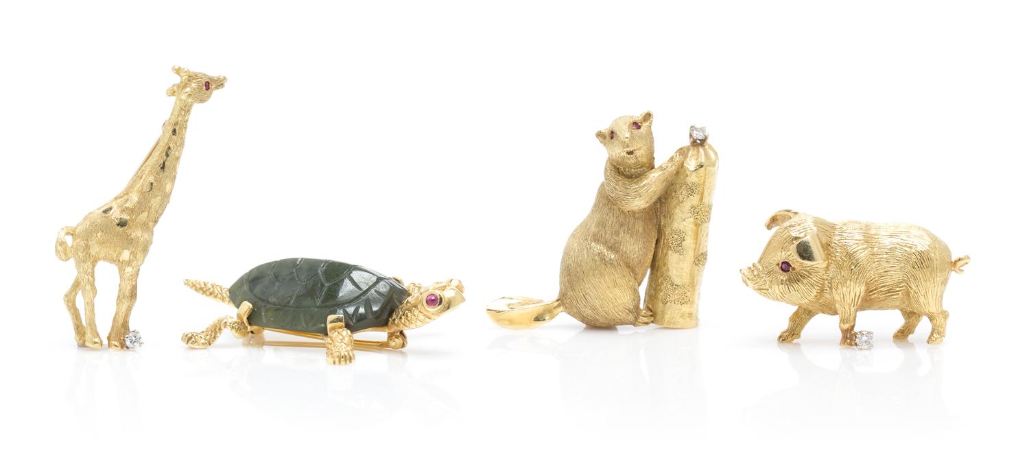 A Collection of Yellow Gold, Ruby and Diamond Animal Brooches, 34.70 dwts.
