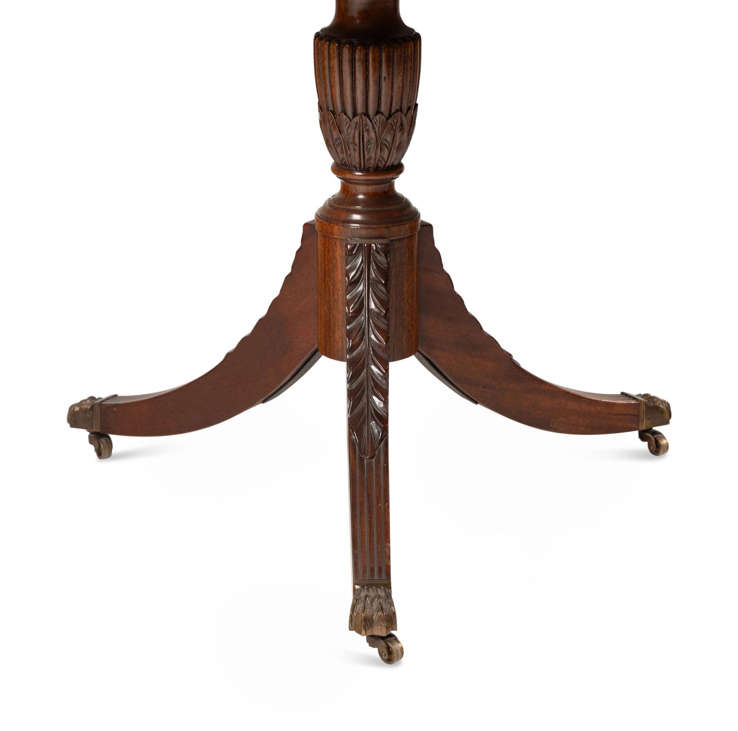 A Regency Style Mahogany and Satinwood Extension Dining Table