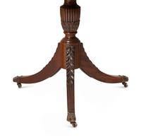 A Regency Style Mahogany and Satinwood Extension Dining Table