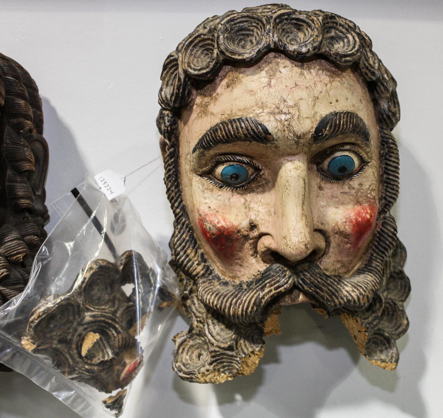 A Central American Carved Wood Mask Height of first 12 inches.