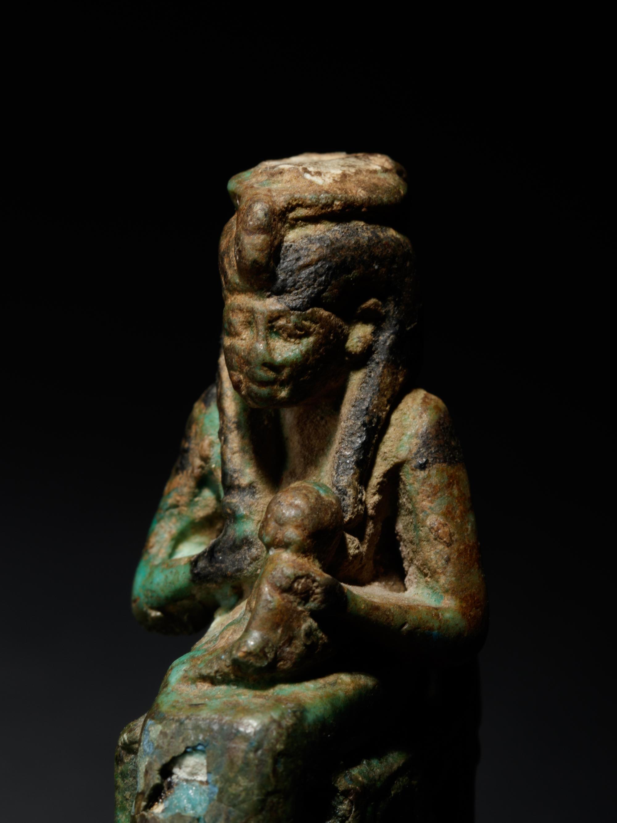 An Egyptian Faience Isis and Horus and an Egyptian Faience Sekhmet