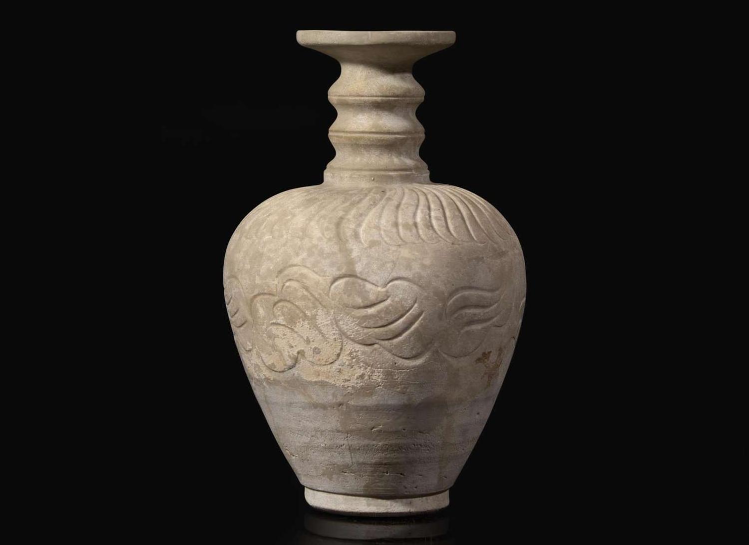 An unusual carved whiteware bottle vase, possibly Qingbai or Yueyao 白陶瓶 可能為青白或越窯