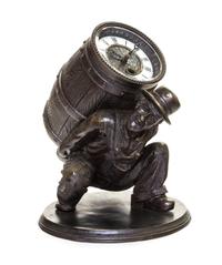 A Patinated Cast Metal Figural Clock Height 8 3/4 inches. — 19TH/20TH CENTURY