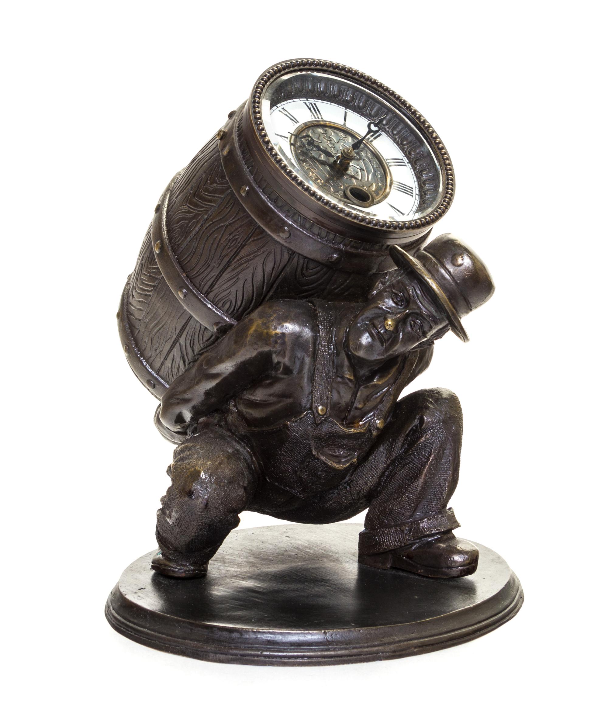 A Patinated Cast Metal Figural Clock Height 8 3/4 inches. — 19TH/20TH CENTURY