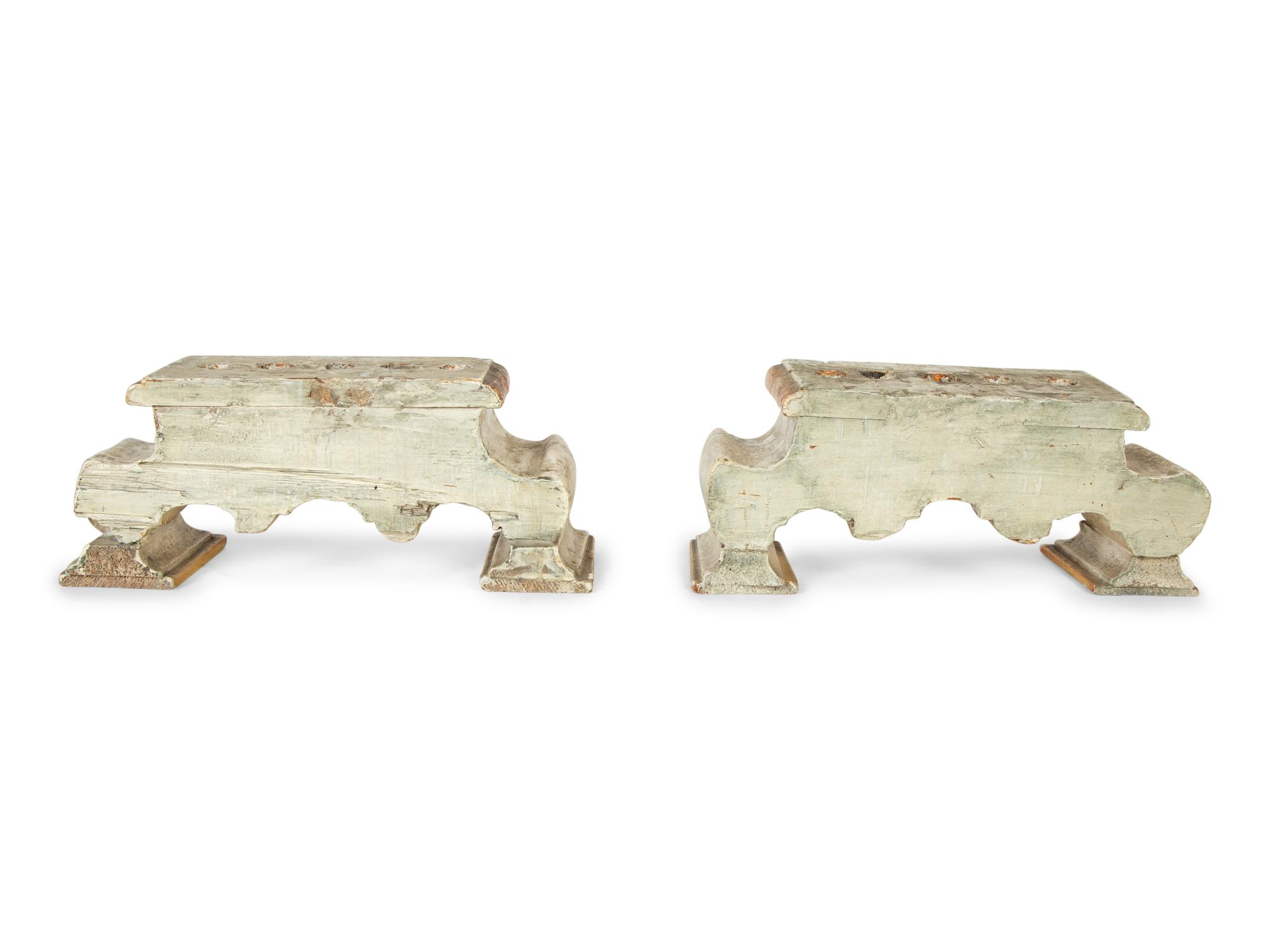 A Pair of Continental Painted and Parcel Gilt Candelabra