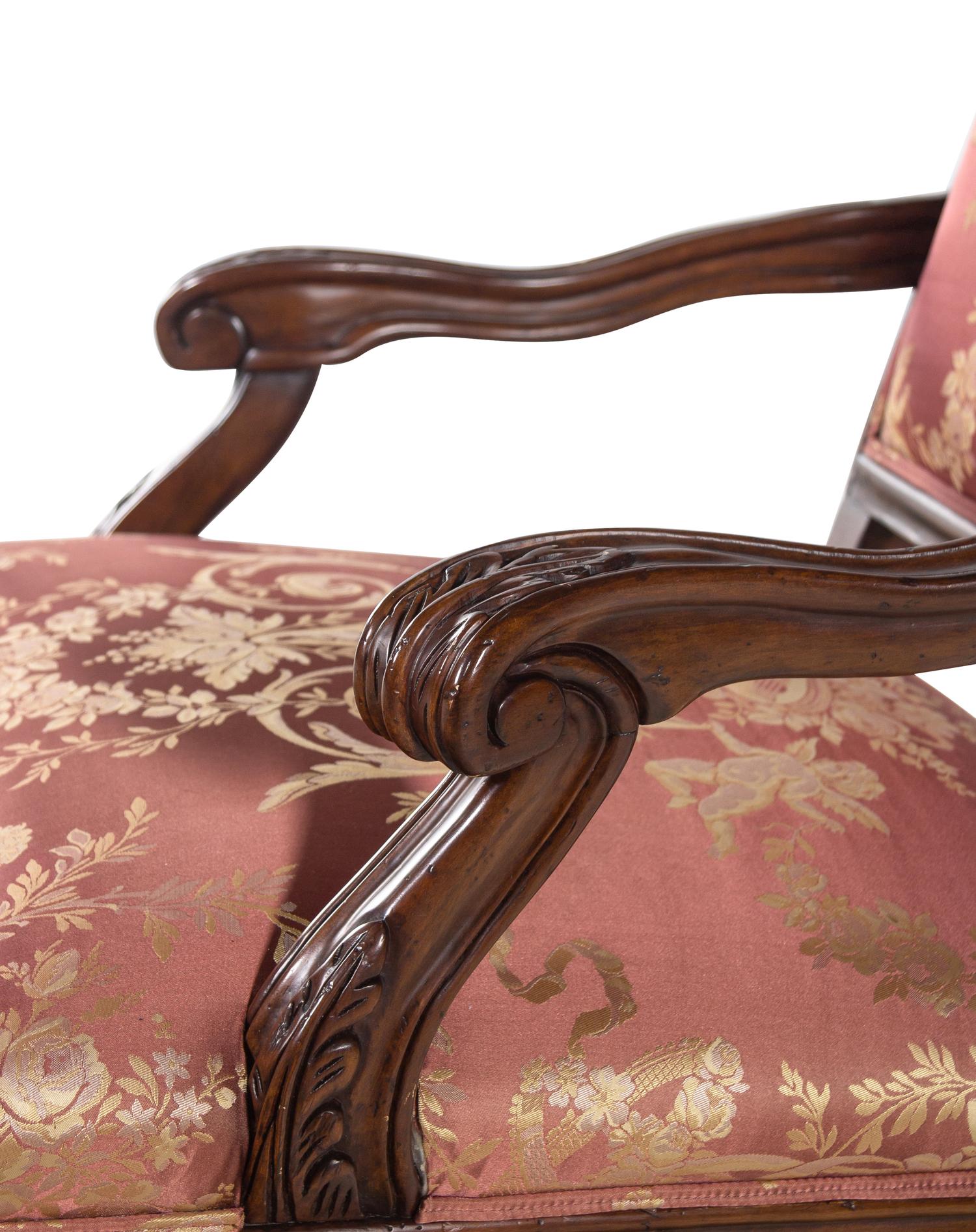 A Pair of Régence Style Walnut Fauteuils