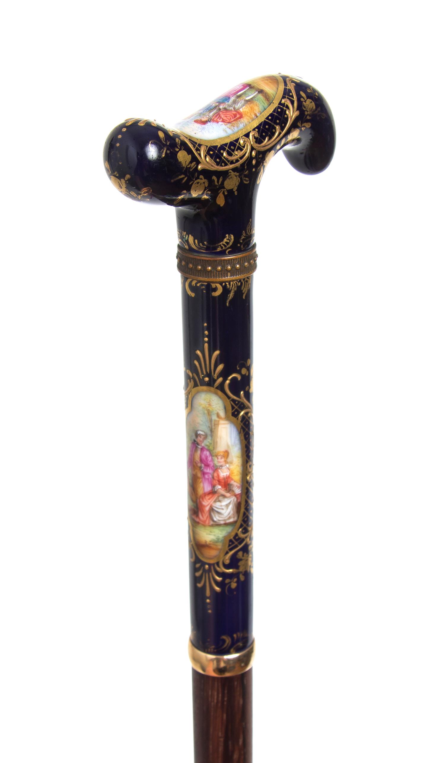 A Sevres Style Porcelain Handled Cane, Length of handle 6 x length overall 36 inches.