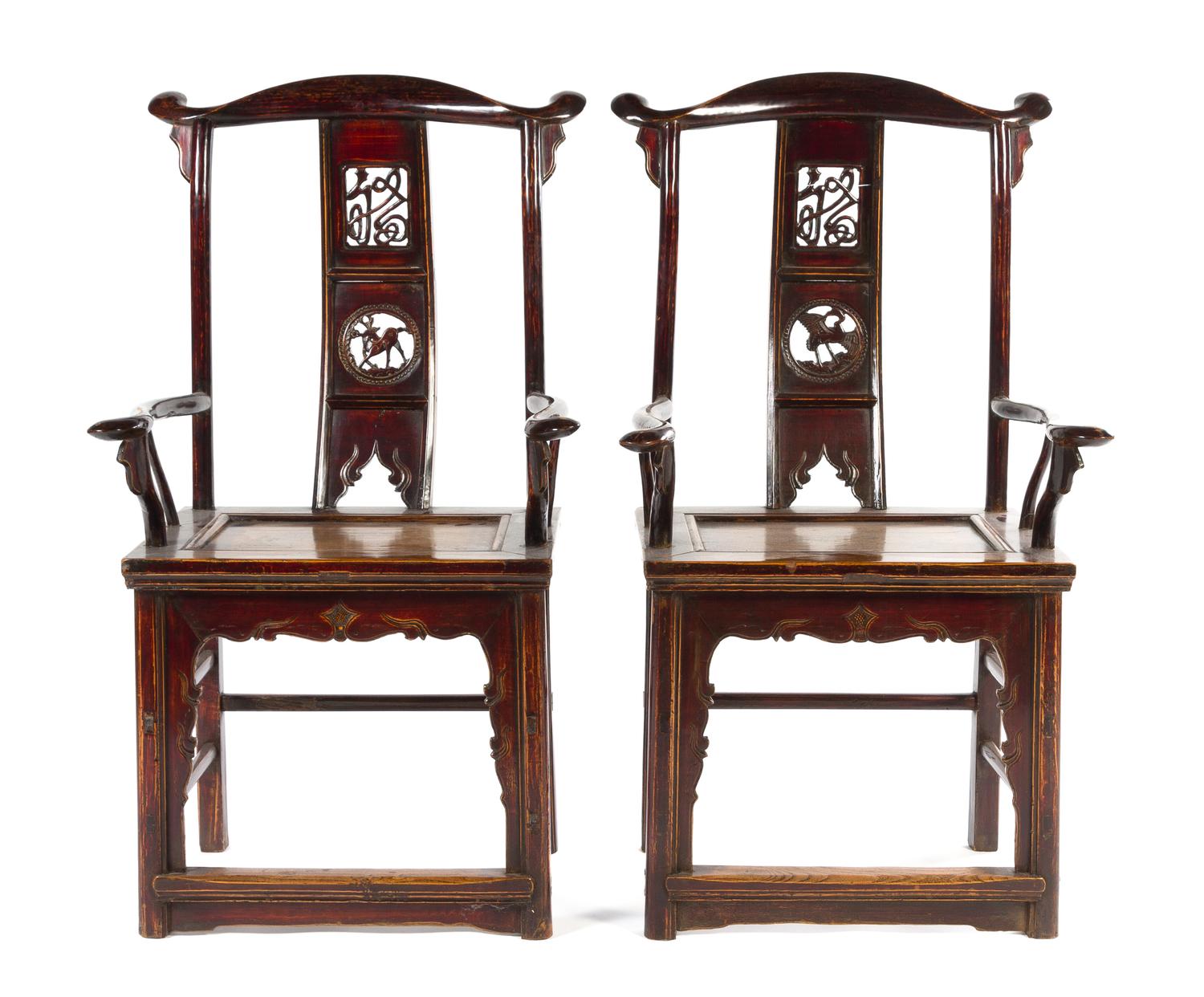 A Pair of Black Lacquered Elmwood Yoke-Back Armchairs MING STYLE Height of pair 45 3/4 inches. — MING STYLE