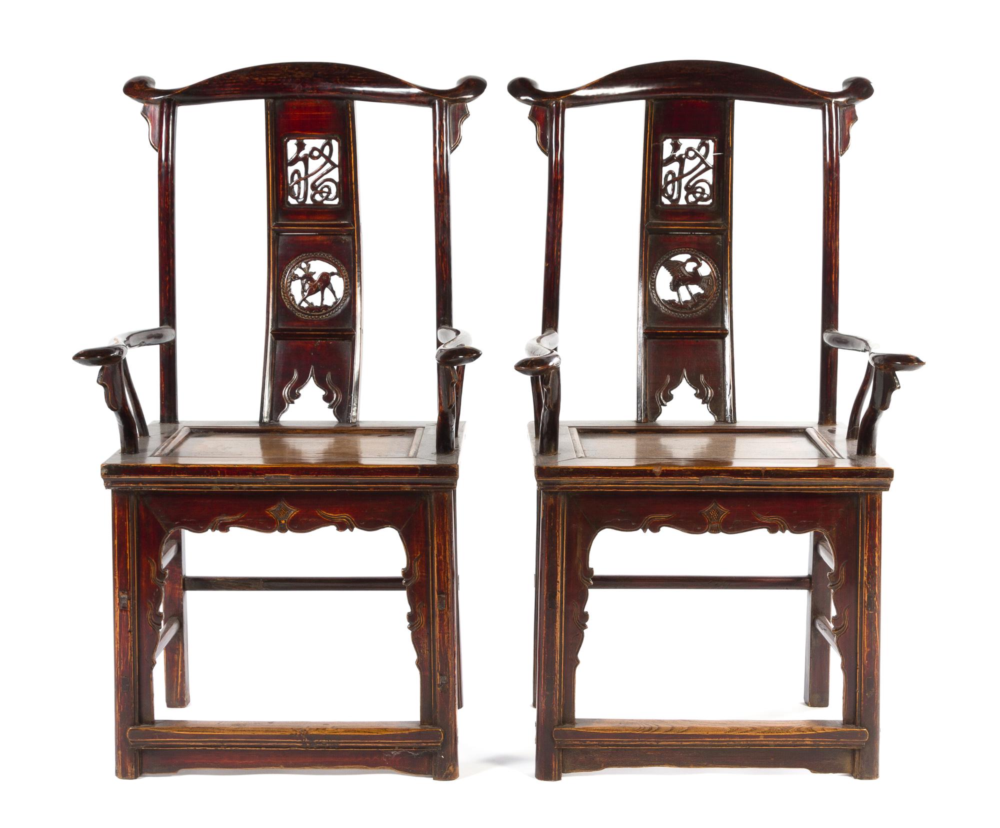 A Pair of Black Lacquered Elmwood Yoke-Back Armchairs MING STYLE Height of pair 45 3/4 inches. — MING STYLE