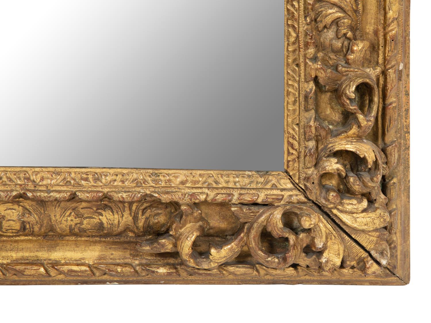 A Continental Carved Giltwood Mirror