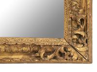 A Continental Carved Giltwood Mirror