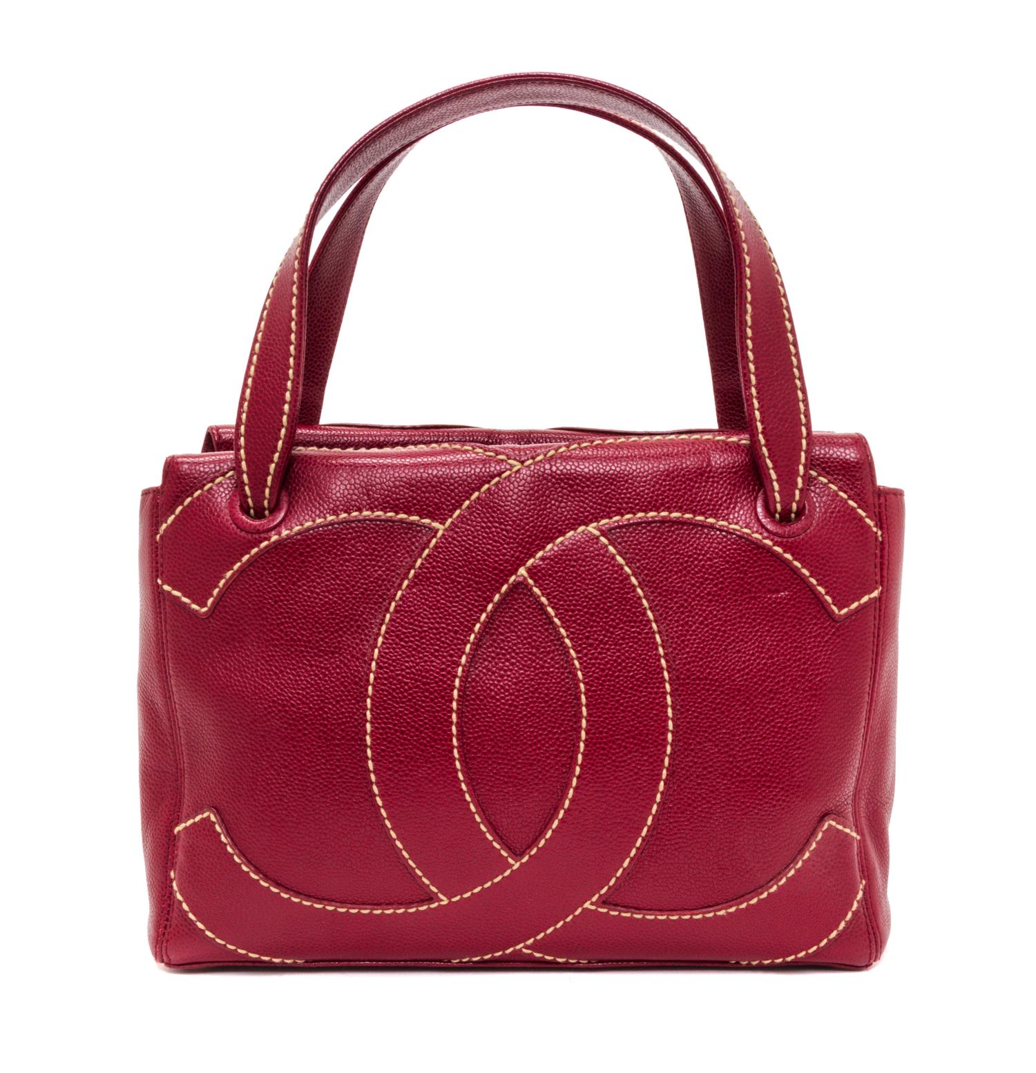 A Chanel Dark Red Caviar Leather Handbag, 11" x 8" x 3.75".