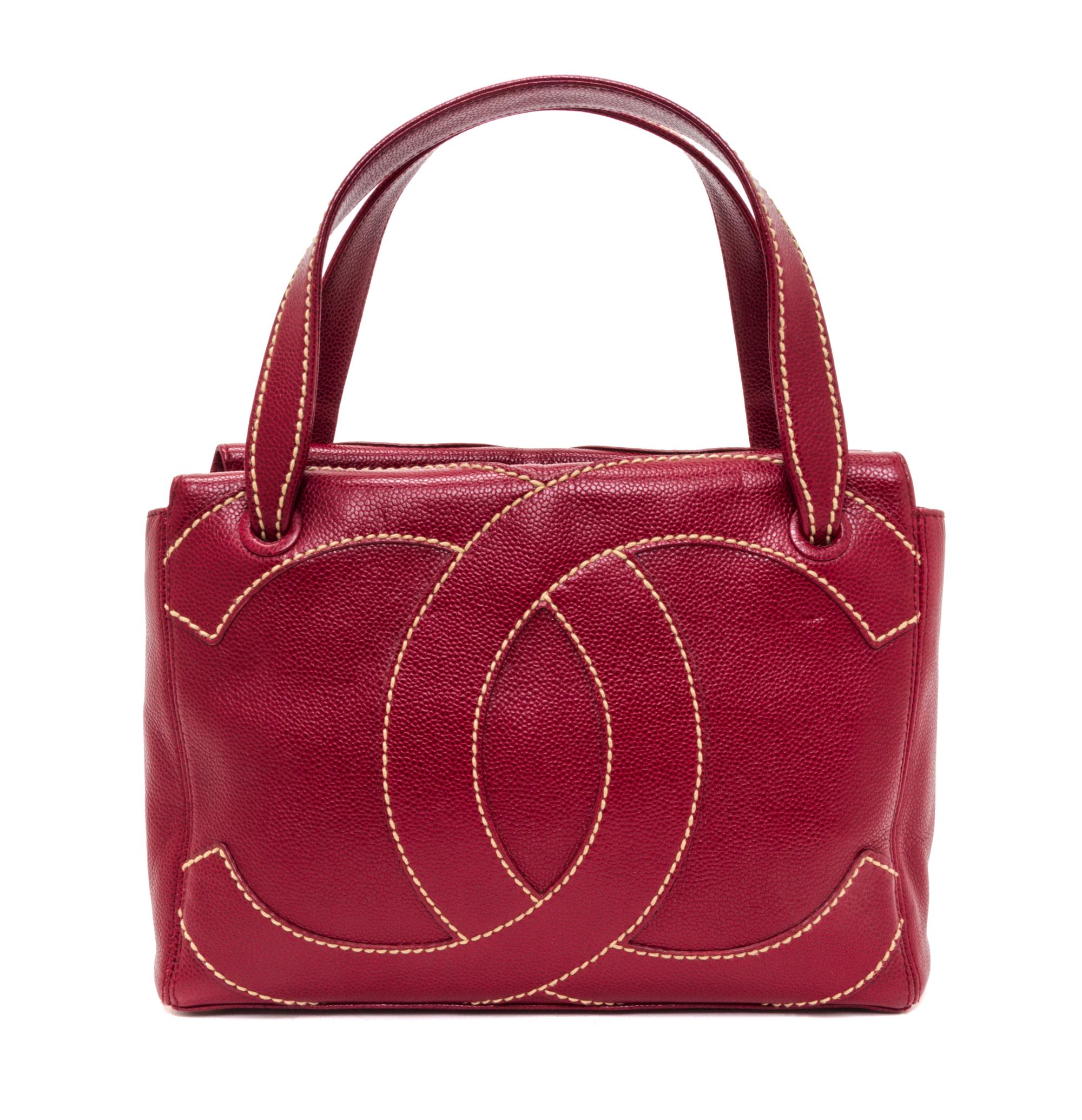 A Chanel Dark Red Caviar Leather Handbag, 11" x 8" x 3.75".