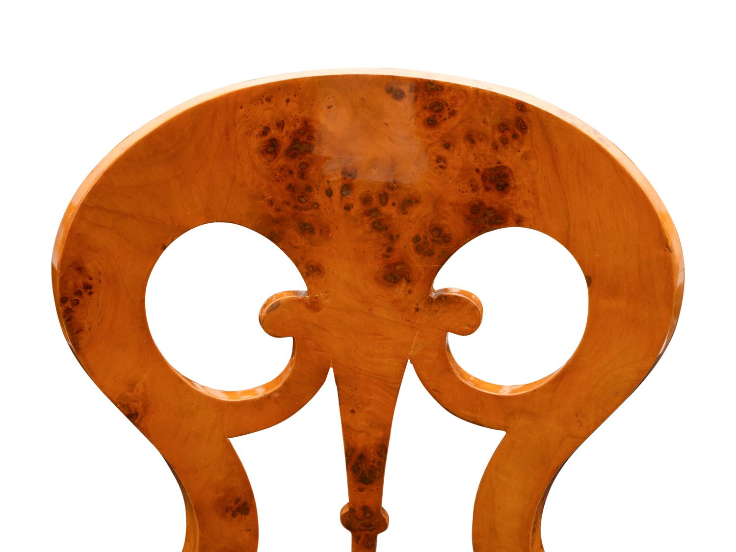 A Set of Twelve Biedermeier Style Burlwood Dining Chairs