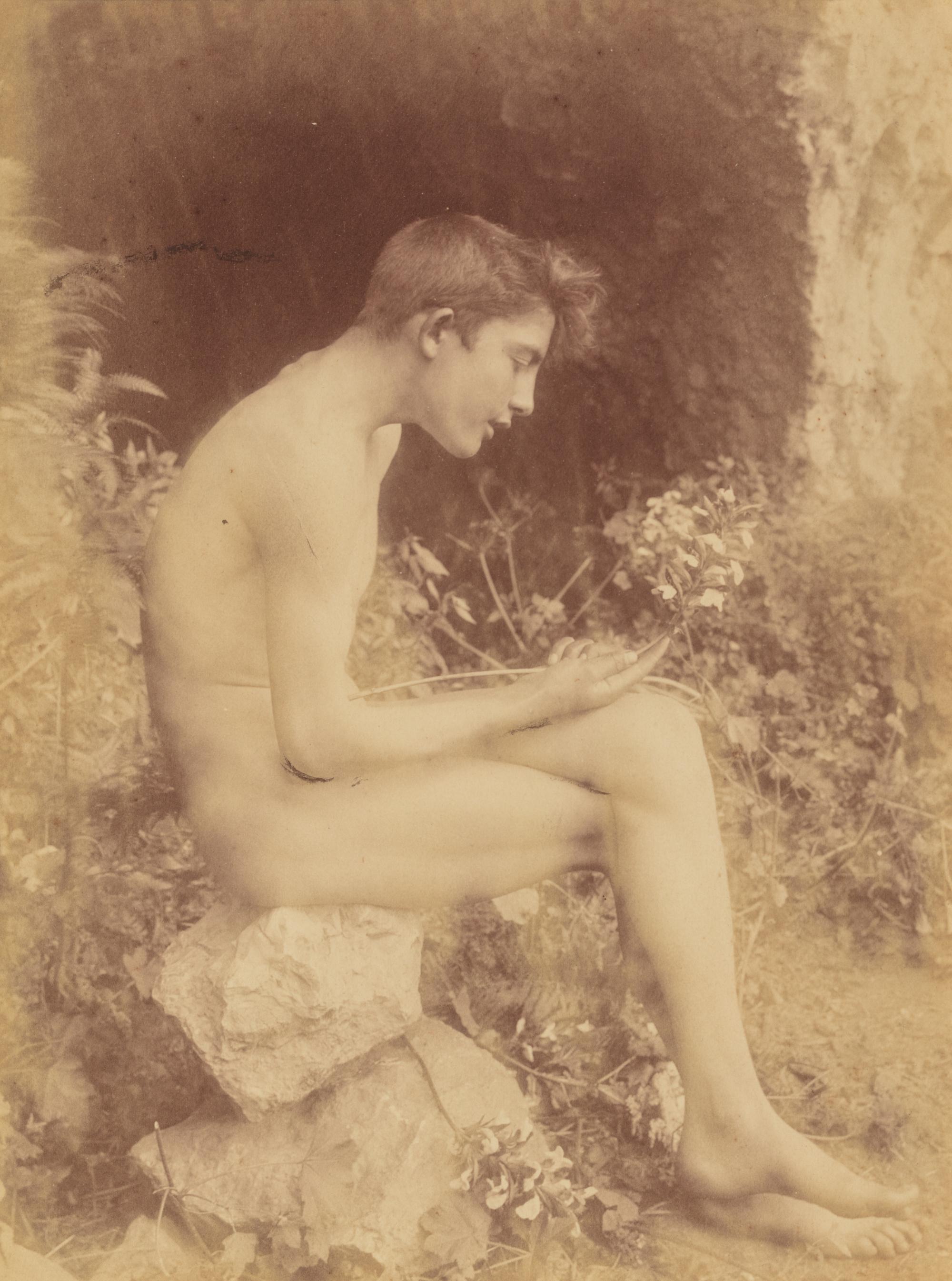 Baron Willem von Gloeden (1856-1931) Untitled (Boy seated on rocks), 1890s