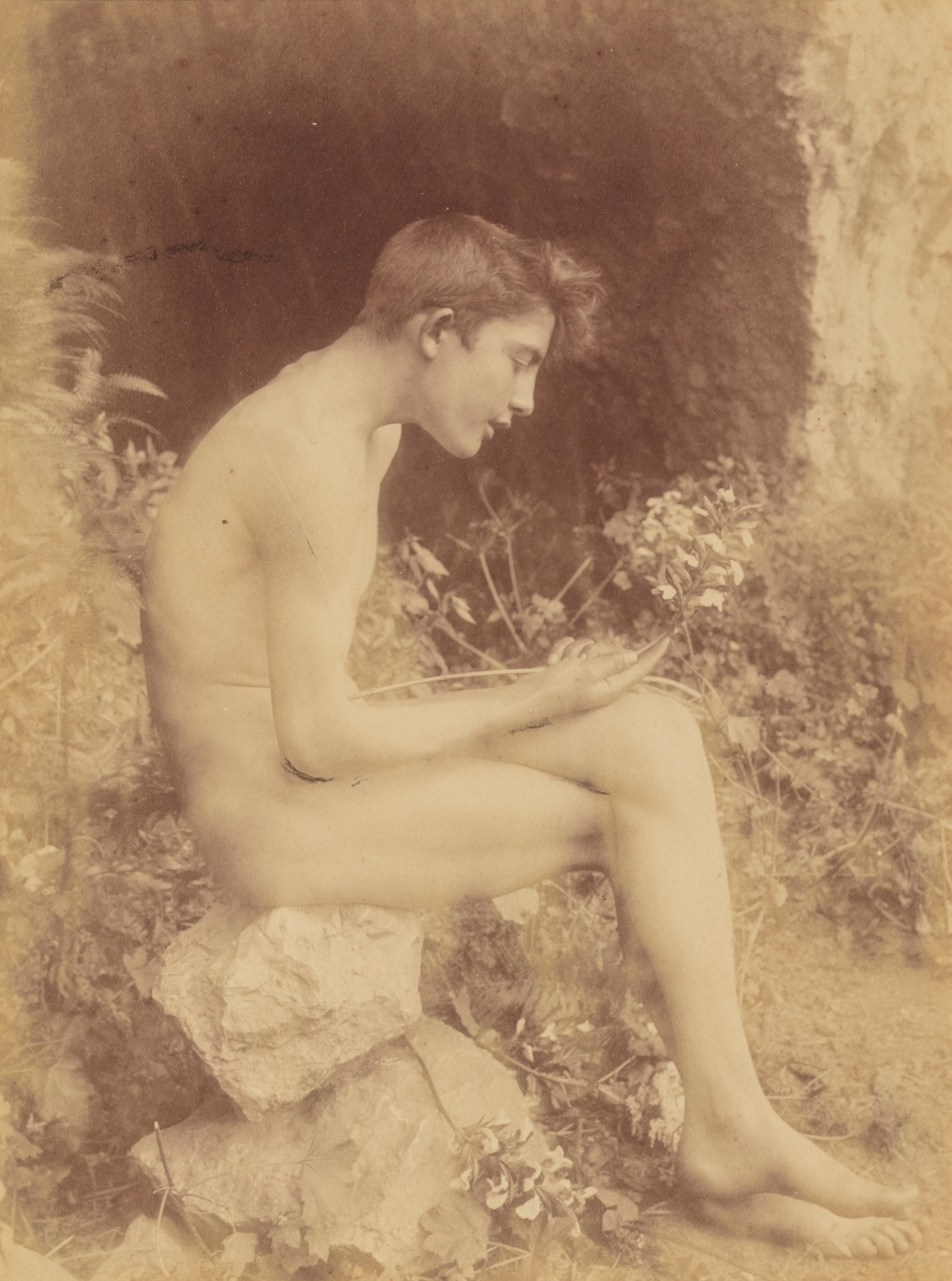 Baron Willem von Gloeden (1856-1931) Untitled (Boy seated on rocks), 1890s