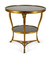 A Gilt Bronze Two-Tier Gueridon with Inset Black Marble Top and Shelf — 19TH CENTURY