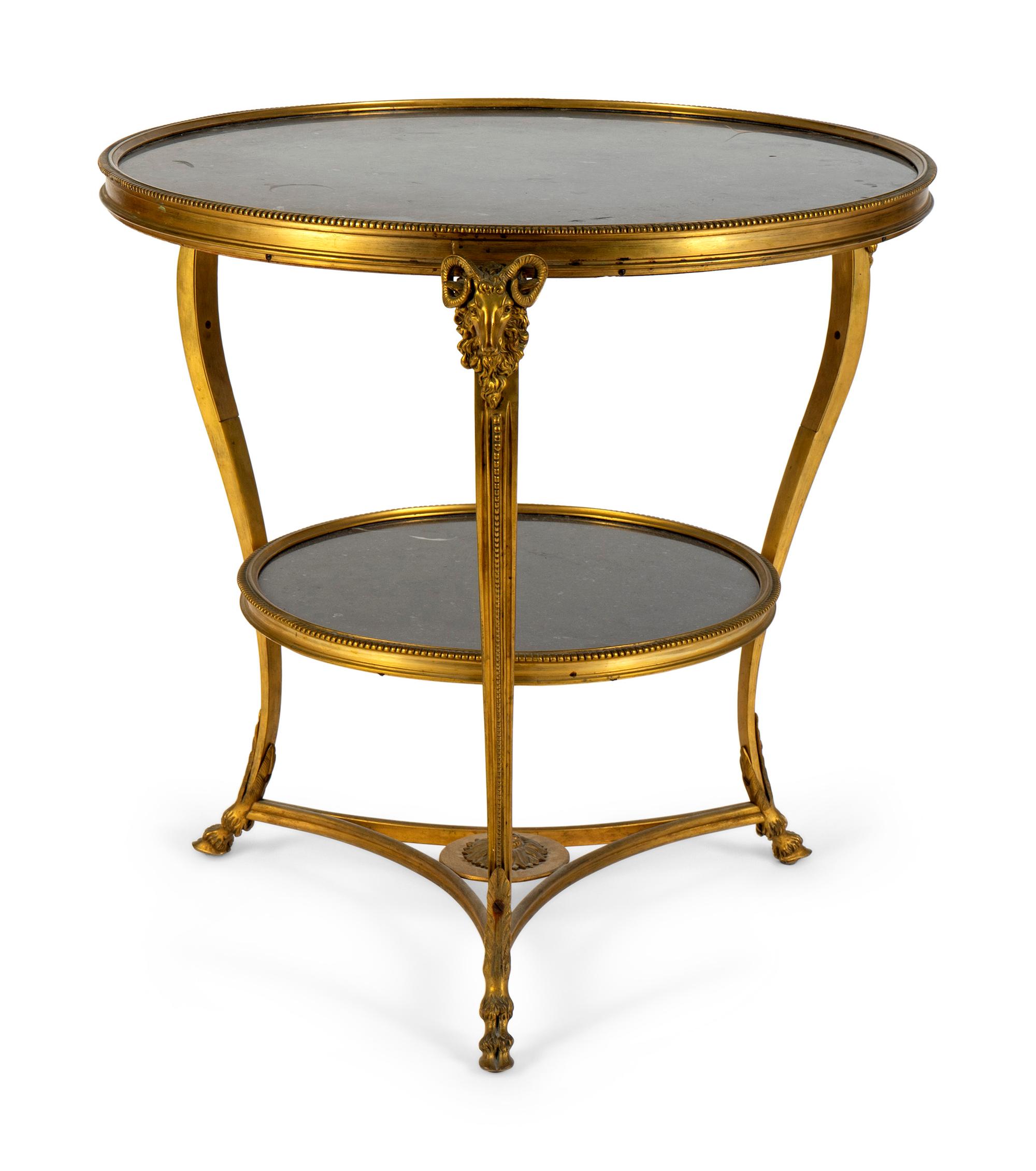 A Gilt Bronze Two-Tier Gueridon with Inset Black Marble Top and Shelf — 19TH CENTURY