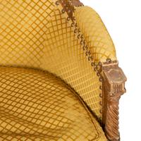 A Louis XVI Style Carved Beech Bergère