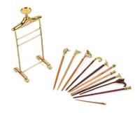 A Group of Eleven Canes and Walking Sticks Height of valet stand 3 3/8 inches.