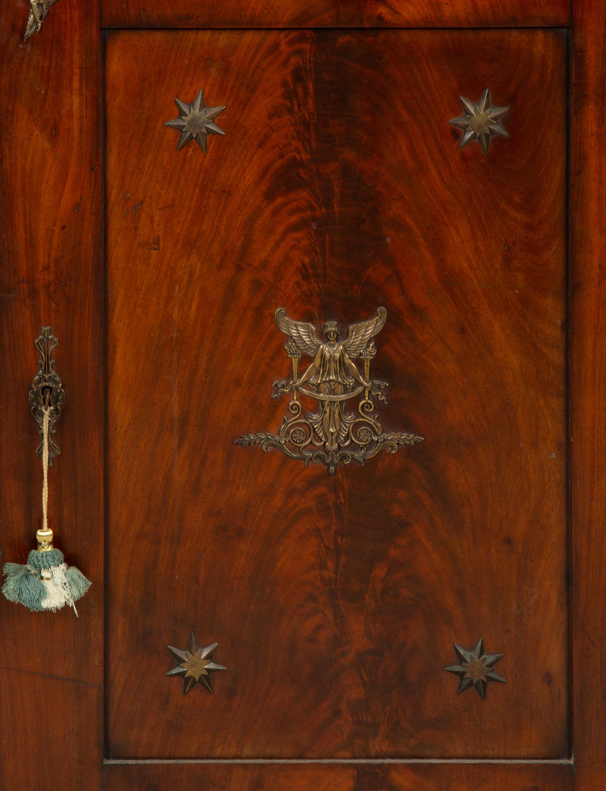 An Empire Gilt Bronze Mounted Mahogany Encoignure with a Brèche d'Alep Marble Top
