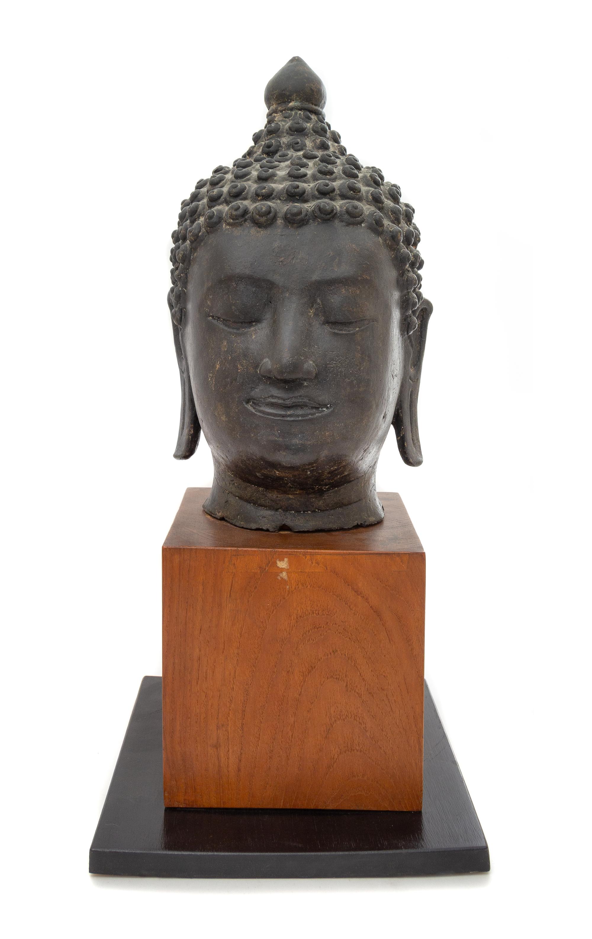 A Thai Bronze Buddha Head Height 15 inches. — 18TH CENTURY