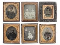 [EARLY PHOTOGRAPHY]. A group of 24 daguerreotypes, ambrotypes, tintypes, and CDVs of children of varying ages, incl. a young boy posed with his dog.