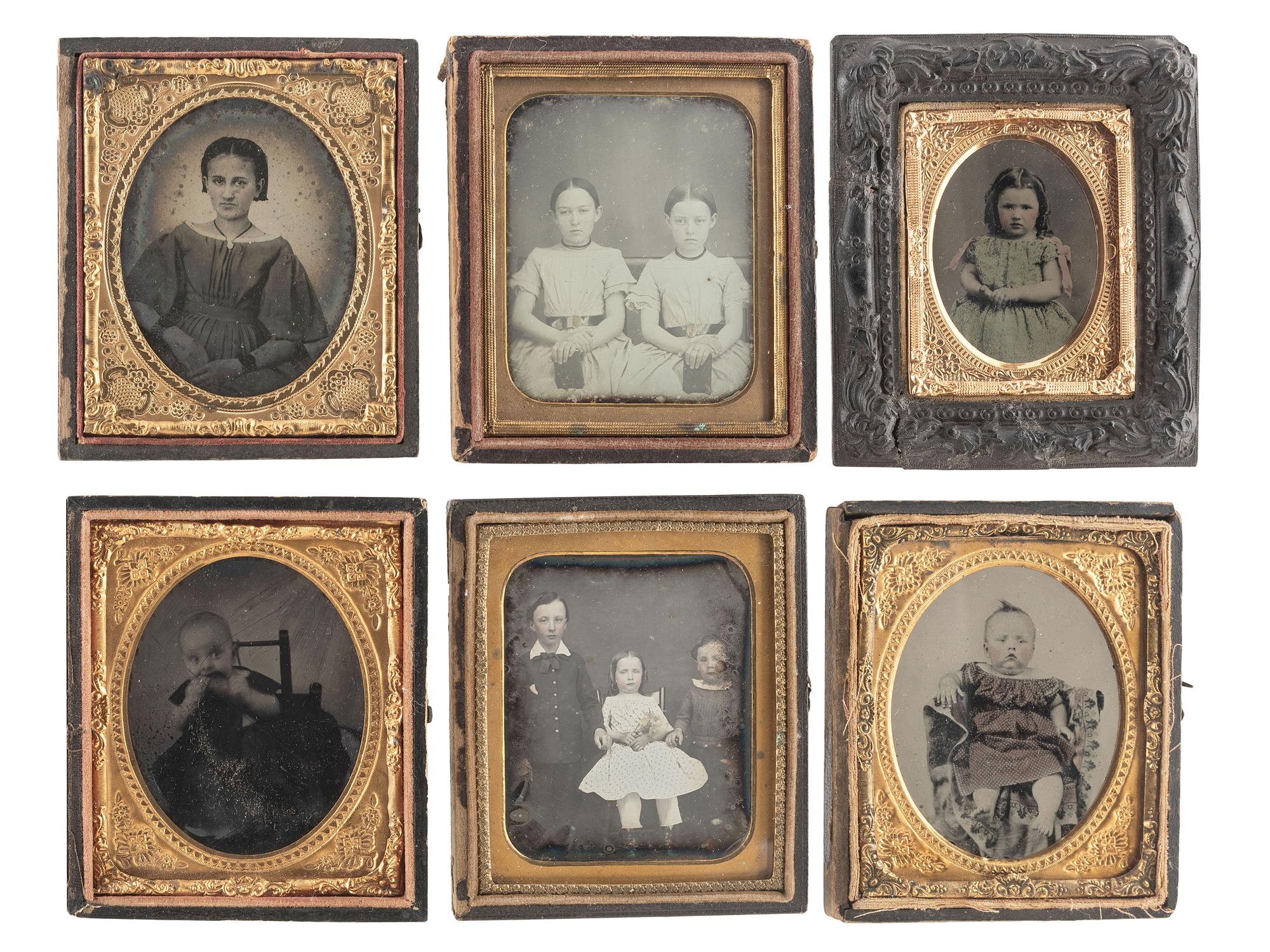 [EARLY PHOTOGRAPHY]. A group of 24 daguerreotypes, ambrotypes, tintypes, and CDVs of children of varying ages, incl. a young boy posed with his dog.