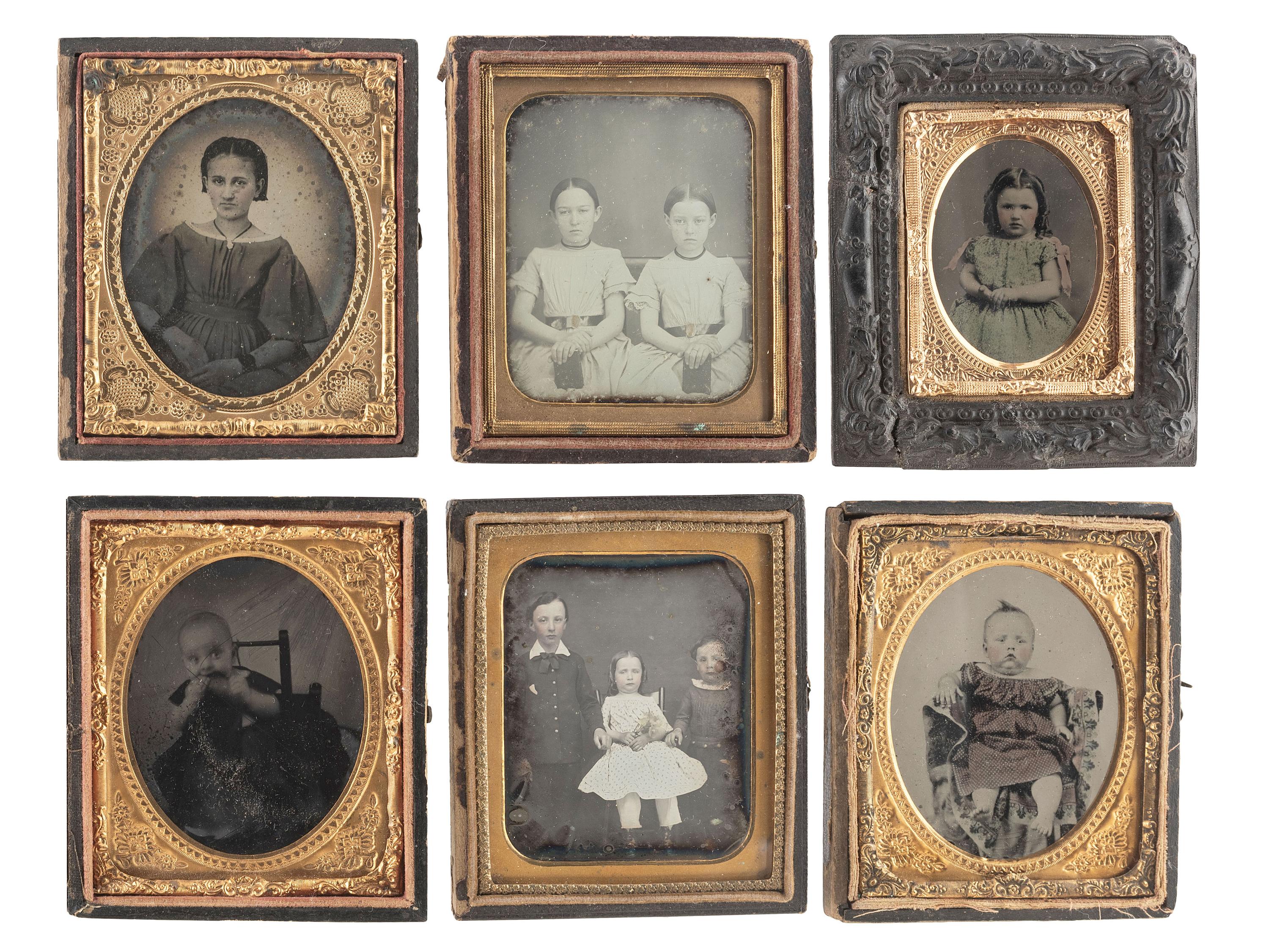 [EARLY PHOTOGRAPHY]. A group of 24 daguerreotypes, ambrotypes, tintypes, and CDVs of children of varying ages, incl. a young boy posed with his dog.