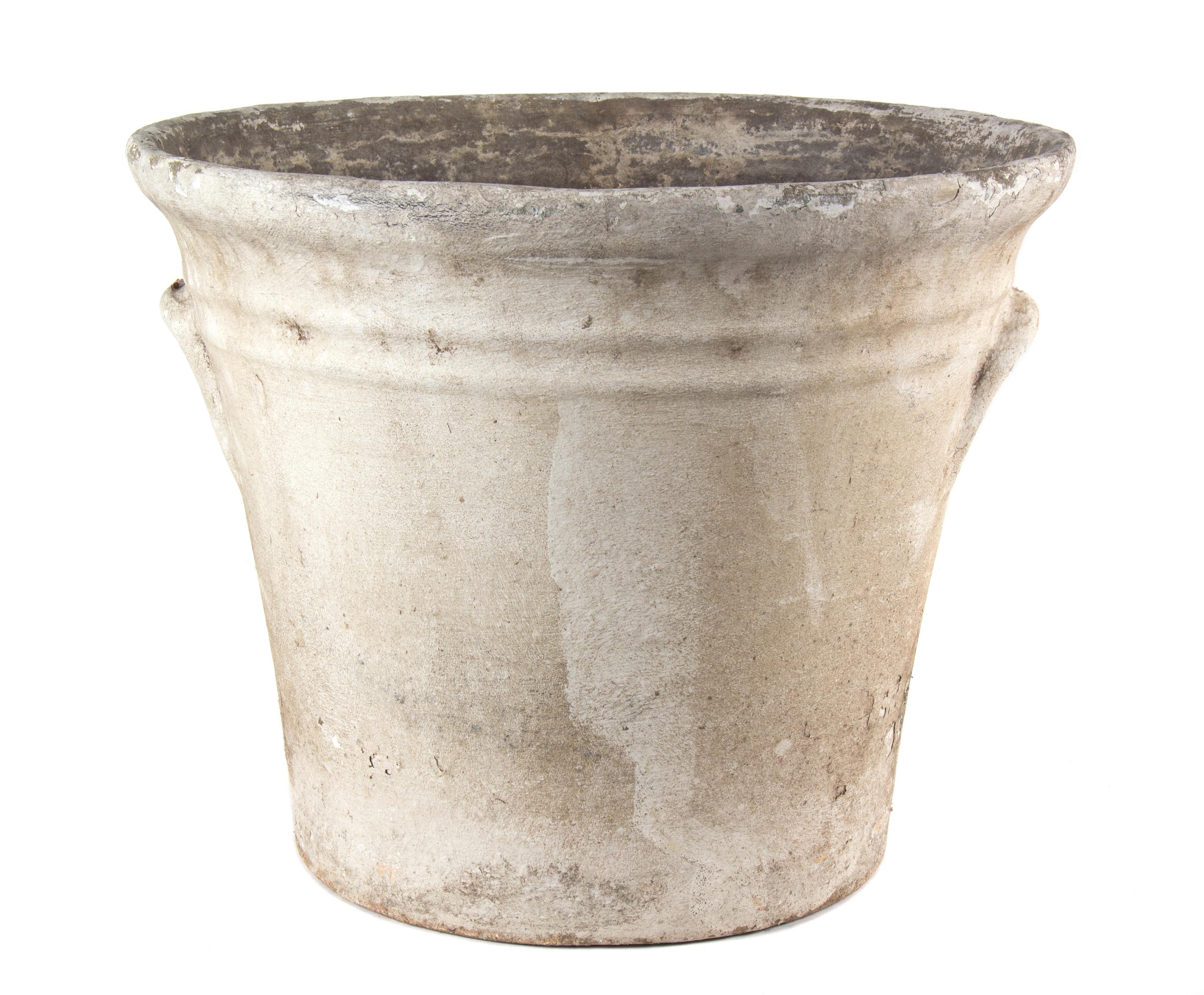 A Group of Concrete Planters Height of largest 18 1/2 inches x diameter 22 inches.