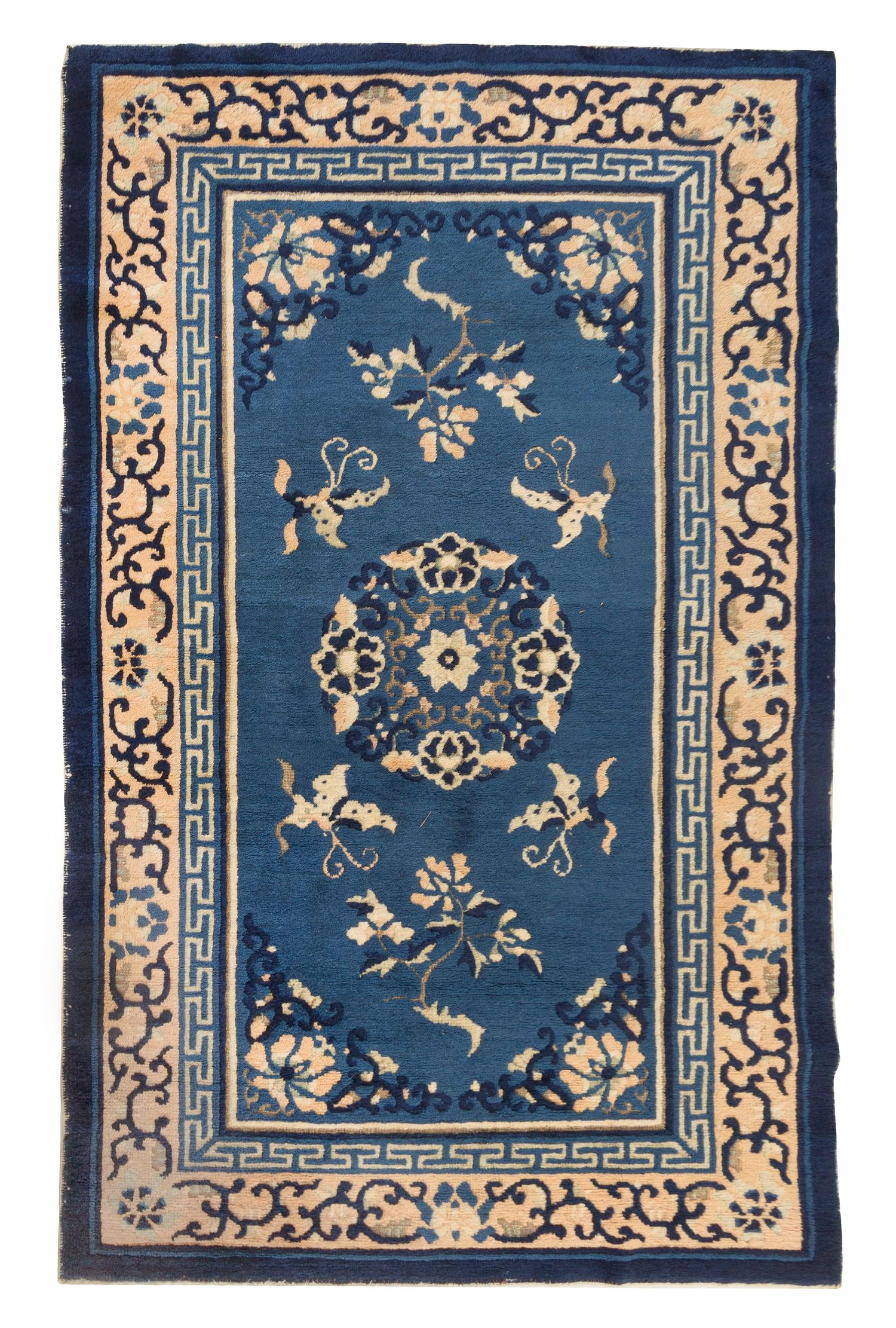 A Chinese Wool Rug Length 2 feet 11 1/2 inches x width 4 feet 9 inches.