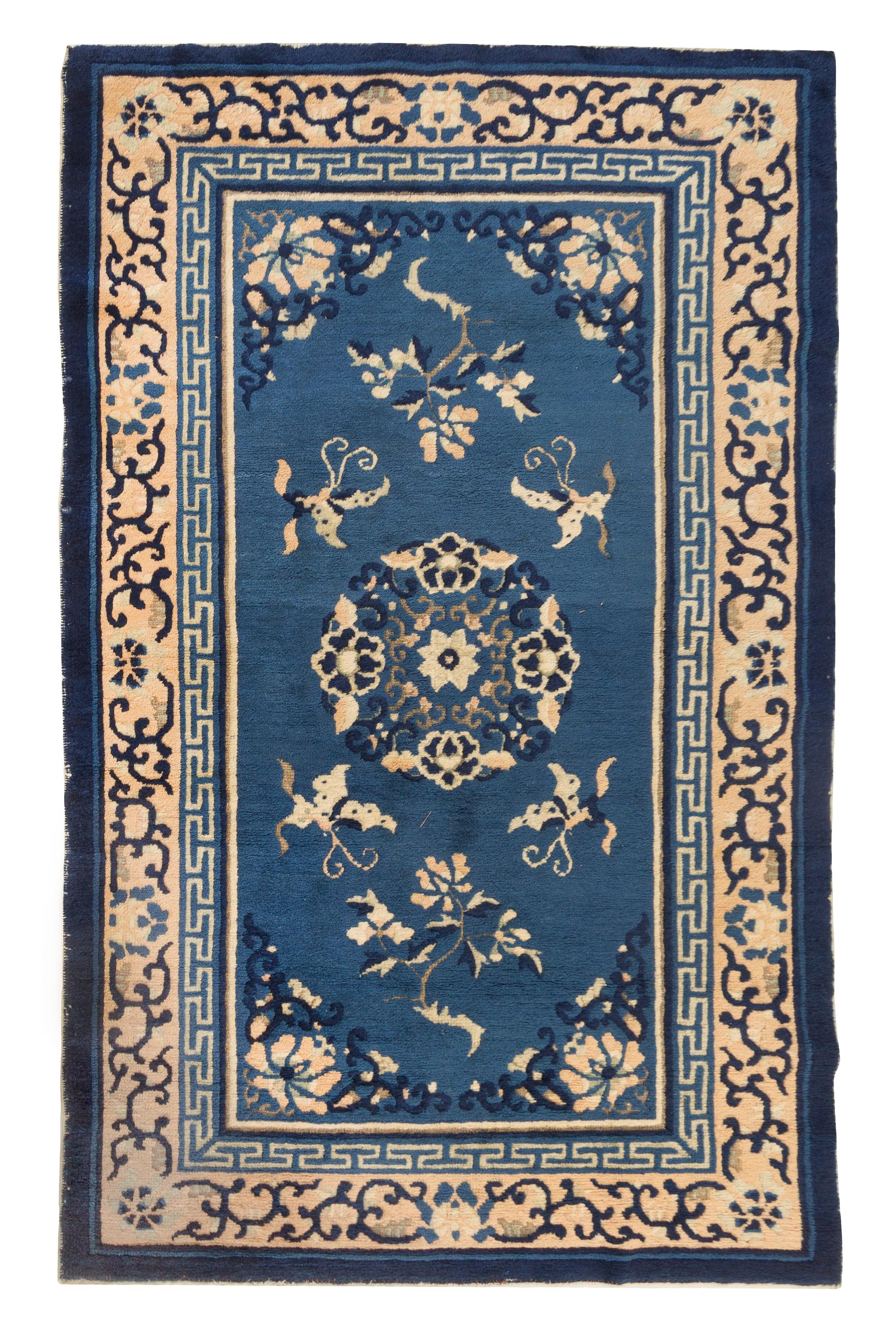 A Chinese Wool Rug Length 2 feet 11 1/2 inches x width 4 feet 9 inches.