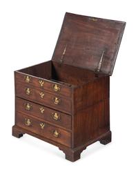 A George III Diminutive Lift-Top Chest of Drawers