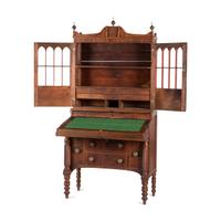 A Classical Figured Maple and Mahogany Desk-and-Bookcase