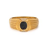 TINELLI, YELLOW GOLD, ONYX, AND DIAMOND 'ARIADNE' BANGLE BRACELET