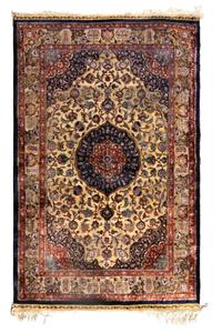 A Qom Silk and Metallic Thread Rug