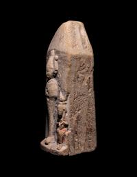 An Egyptian Limestone Case in the Form of an Obelisk with Osiris and Isis