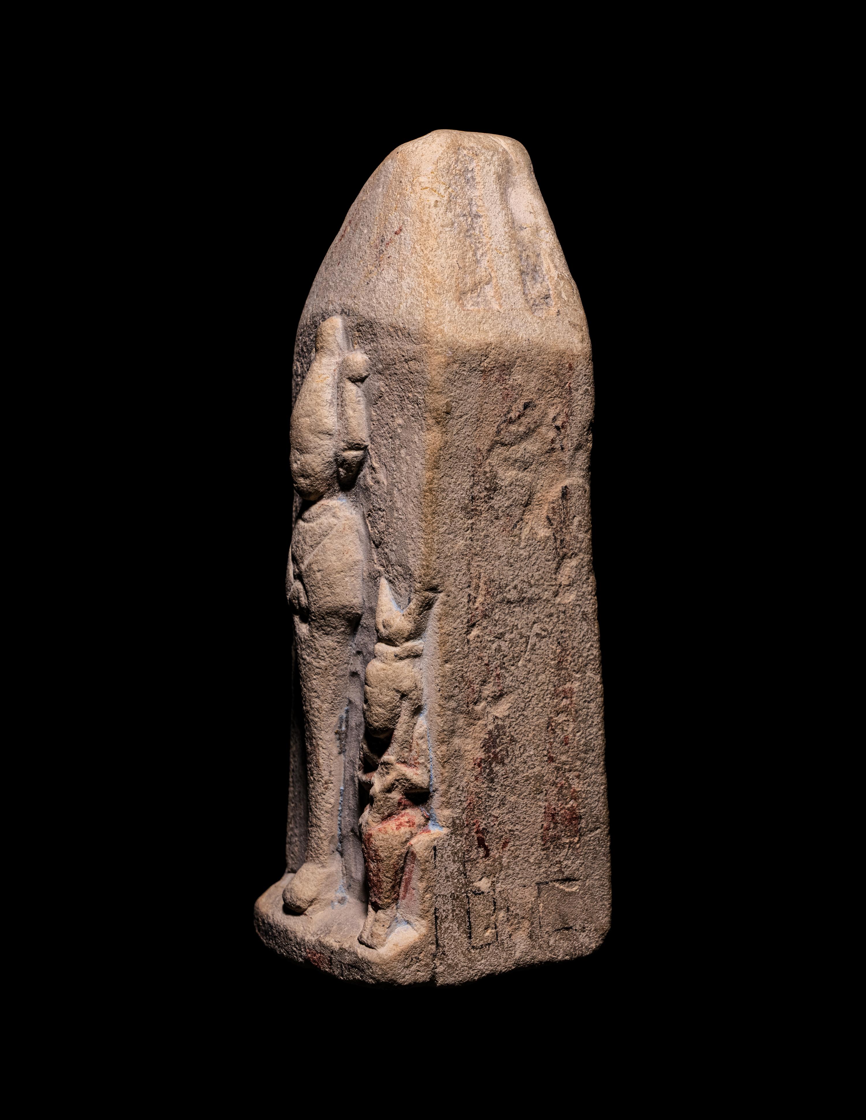 An Egyptian Limestone Case in the Form of an Obelisk with Osiris and Isis