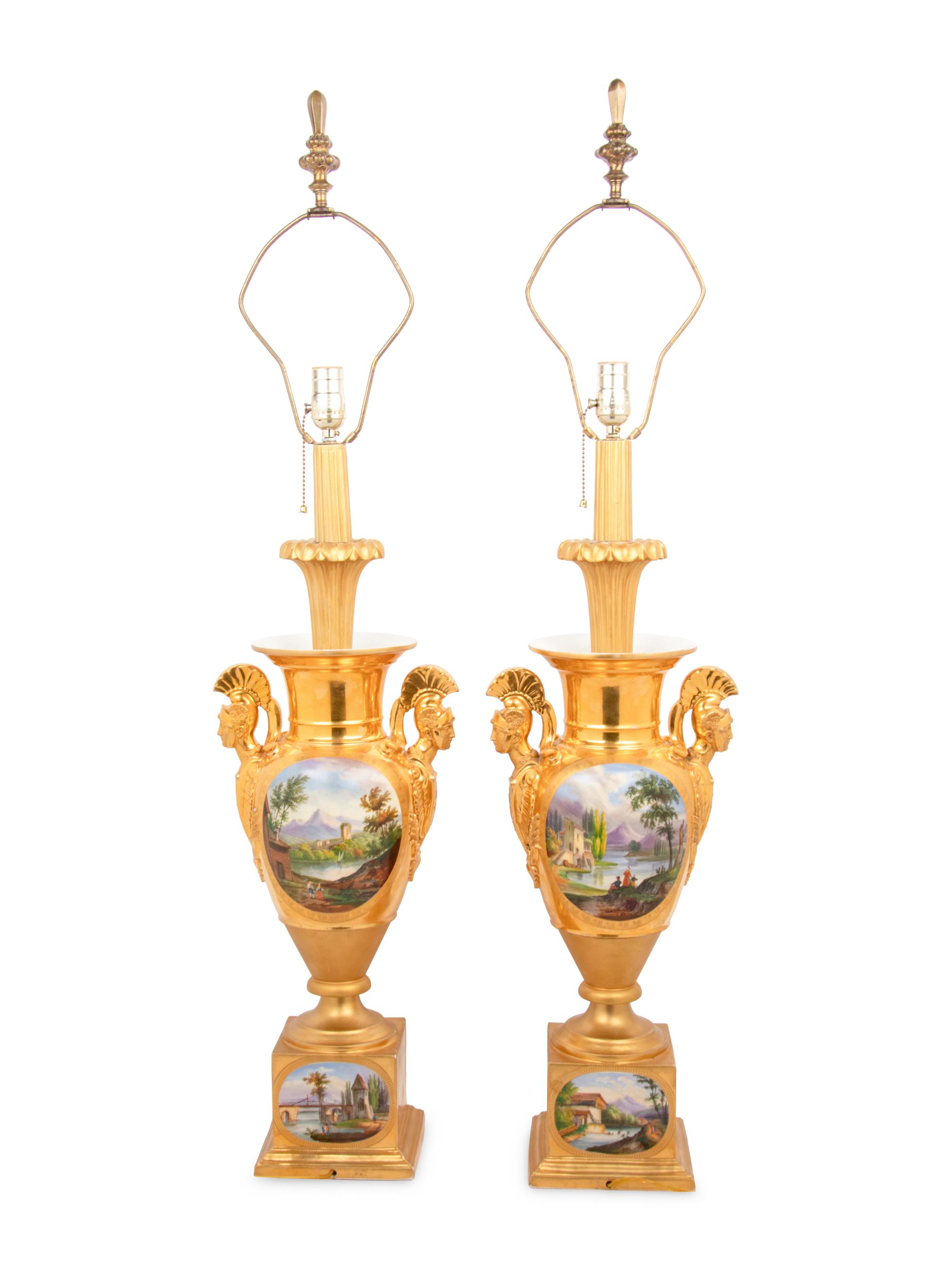 A Pair of Empire Style Painted and Parcel Gilt Porcelain Urns
